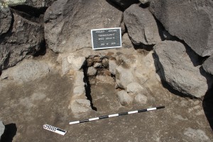 Stone-lined hearth in the east corner