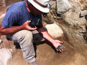 Project ArAGATS co-founder Dr. Ruben Badalyan and an Early Bronze Age obsidian spear head found in operation T30.